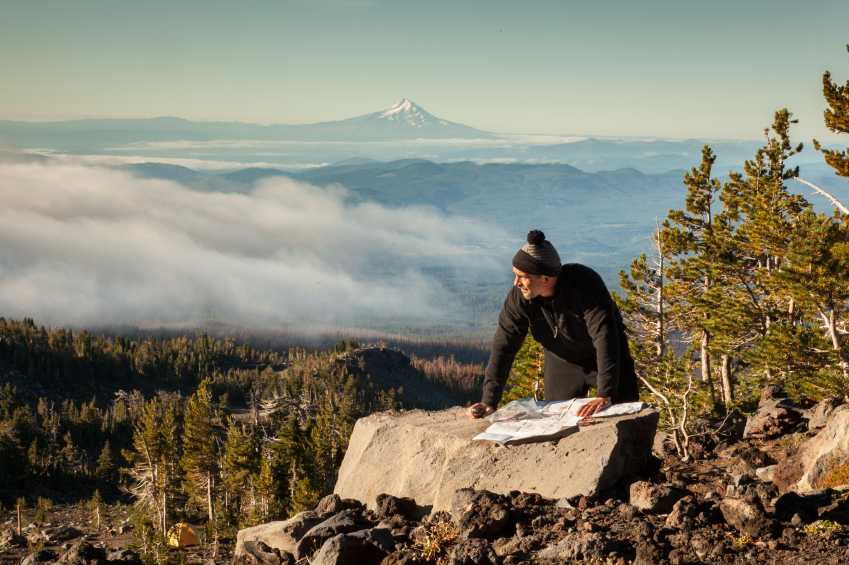 Map at the top of a mountain using a map