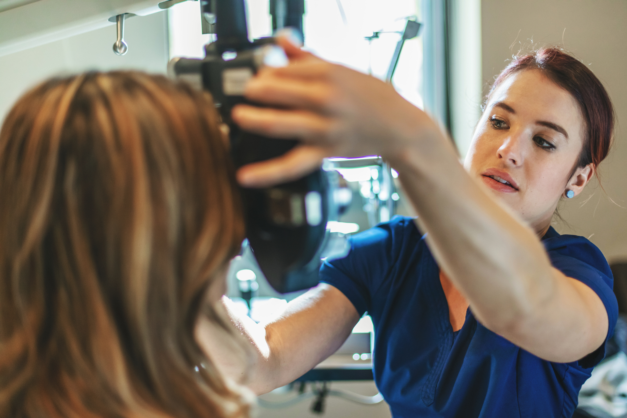Optometrist helping patients